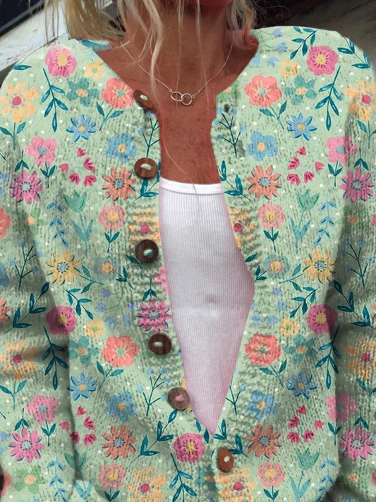 Cardigan femme floral vintage bleu clair à col en V léger, patte boutonnée et manches.