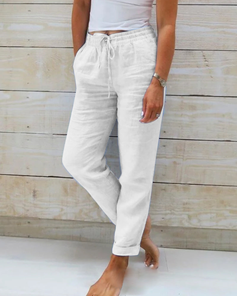 Pantalon en tissu léger blanc, taille élastique à cordon, poches à l’avant