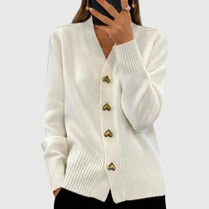 Pull-gilet en maille blanc cassé, col V et boutons dorés, manches longues, poignets côtelés