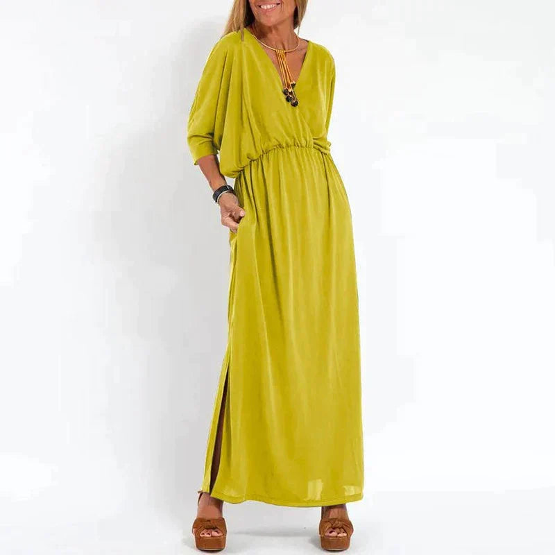 Robe longue vintage jaune, manches 3/4 bouffantes, taille froncée, fente latérale.