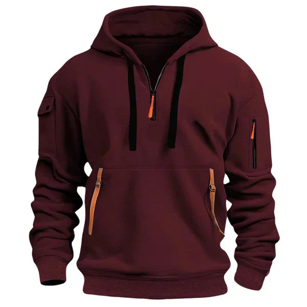 Sweat à capuche bordeaux, zip demi-col, poche kangourou et poches zippées sur les manches