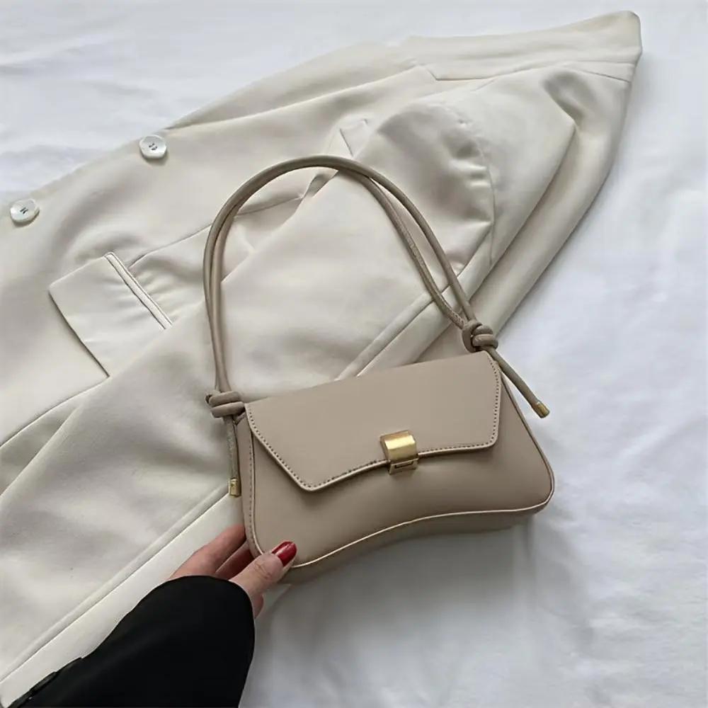 Sac à bandoulière vintage beige à rabat, boucle dorée et bandoulière cordon