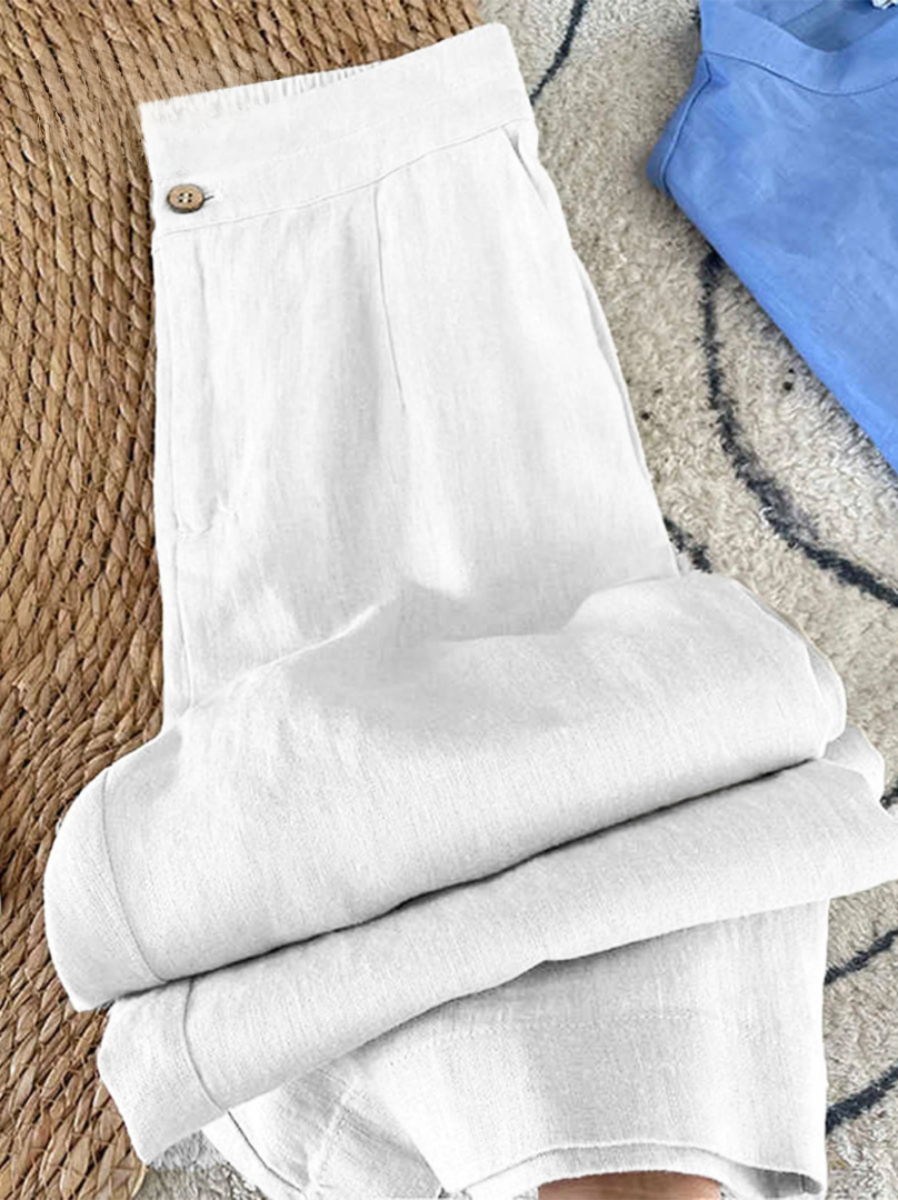 Pantalon en lin Héritage blanc, pli au niveau de la jambe et ourlet