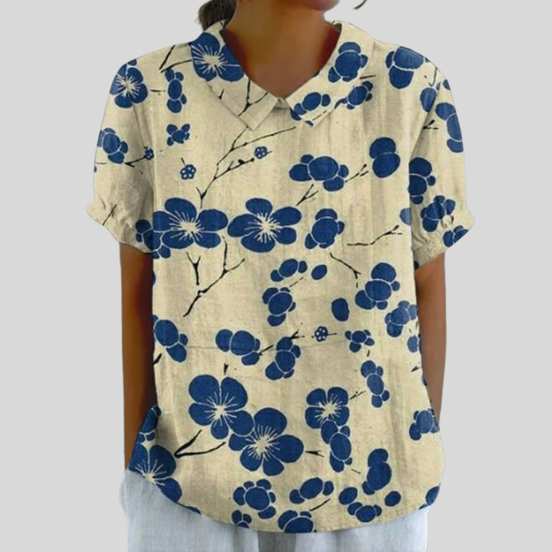 Blouse manches courtes à col, imprimé floral bleu sur fond crème