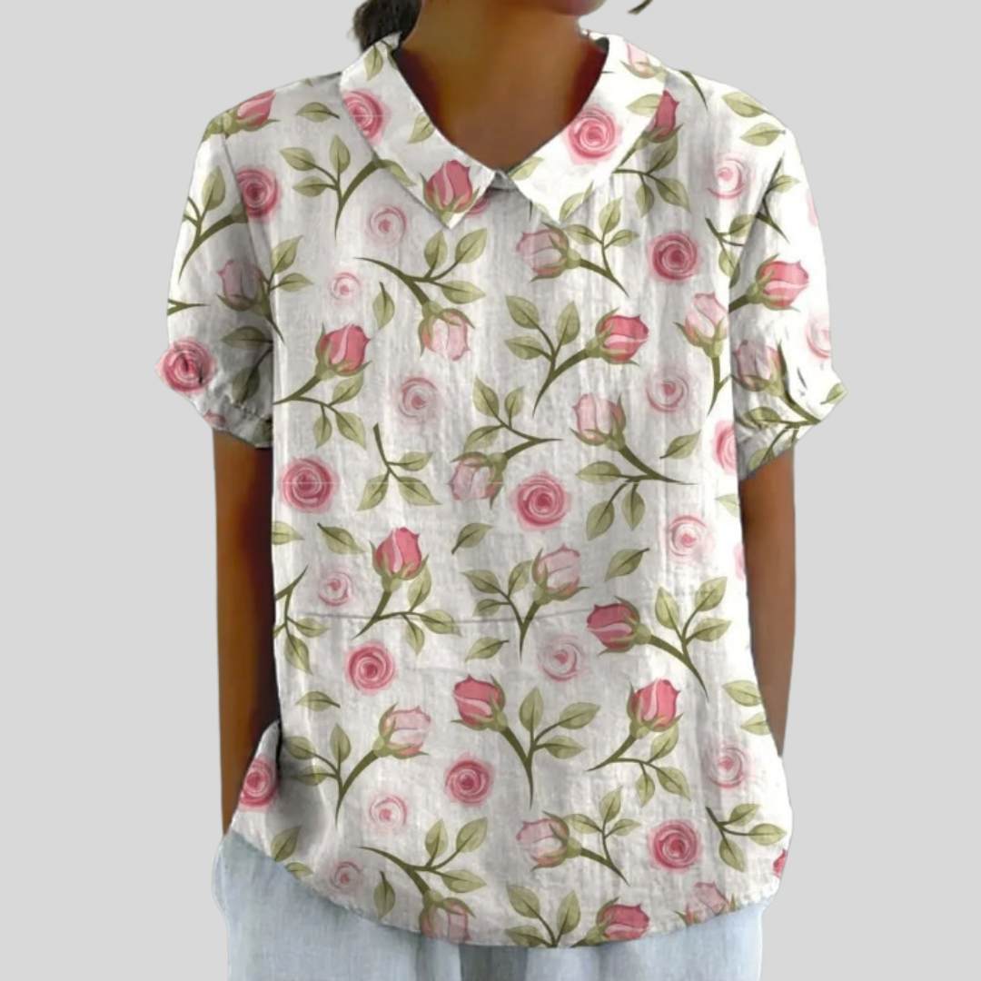 Blouse en coton à manches courtes, col chemise, motif roses délicates multicolores.