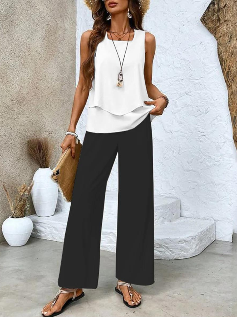 Ensemble estival blanc et noir : haut à volants blanc et pantalon large noir