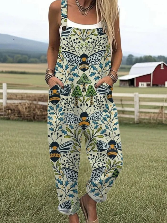 Combinaison sans manches bleue à motifs floraux et papillons