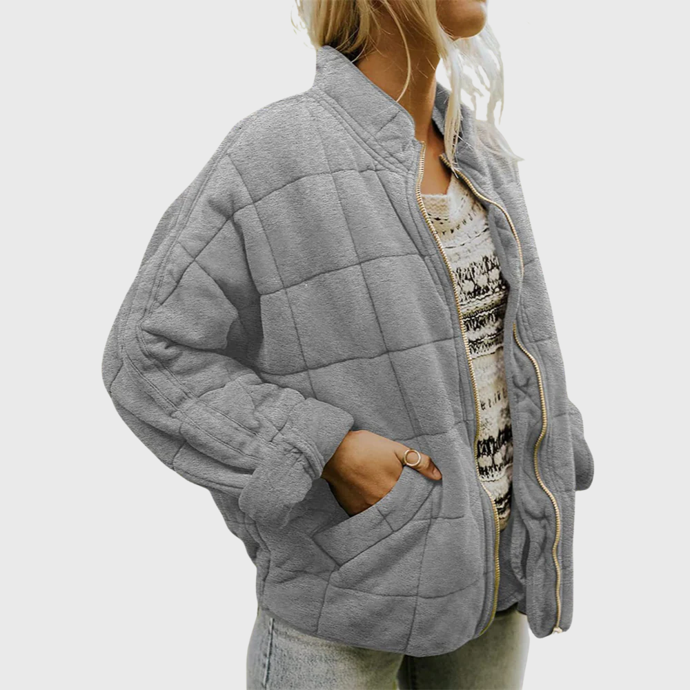 Veste matelassée oversize grise, col montant zippé, poches et bordures contrastées