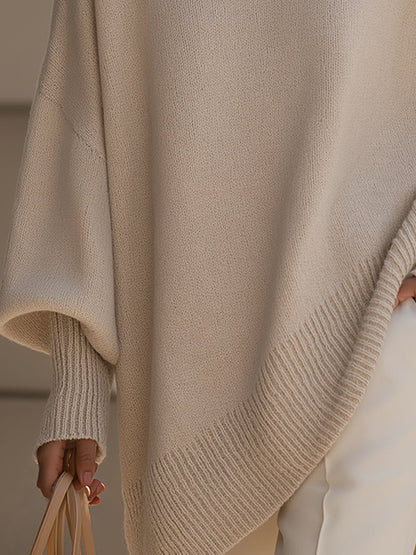Pull ample à coupe fluide beige, maille texturée, ourlet côtelé en diagonale, manches tombantes