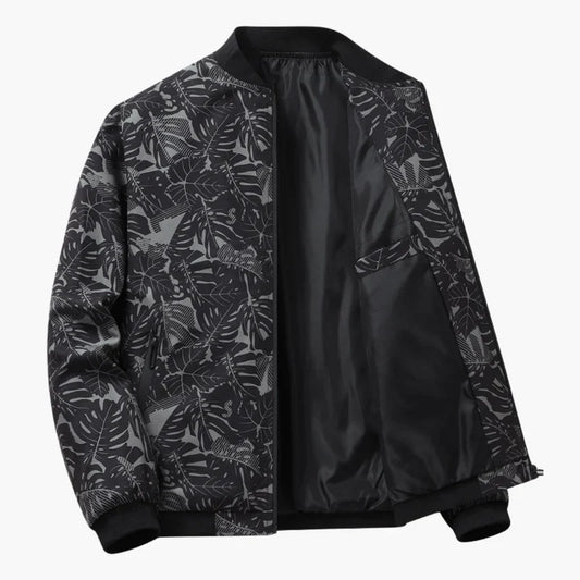 Blouson bomber Louis noir à motif feuillagé gris, fermeture zippée et col côtelé.