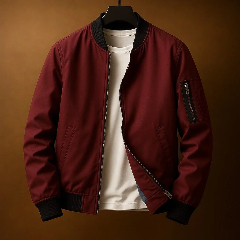 Blouson bomber zippé bordeaux, col et poignets côtelés, poche zippée sur la manche