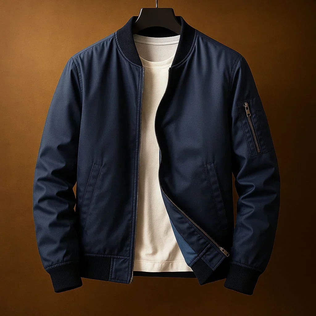 Blouson bomber zippé bleu marine, col et poignets côtelés, poche zippée sur la manche
