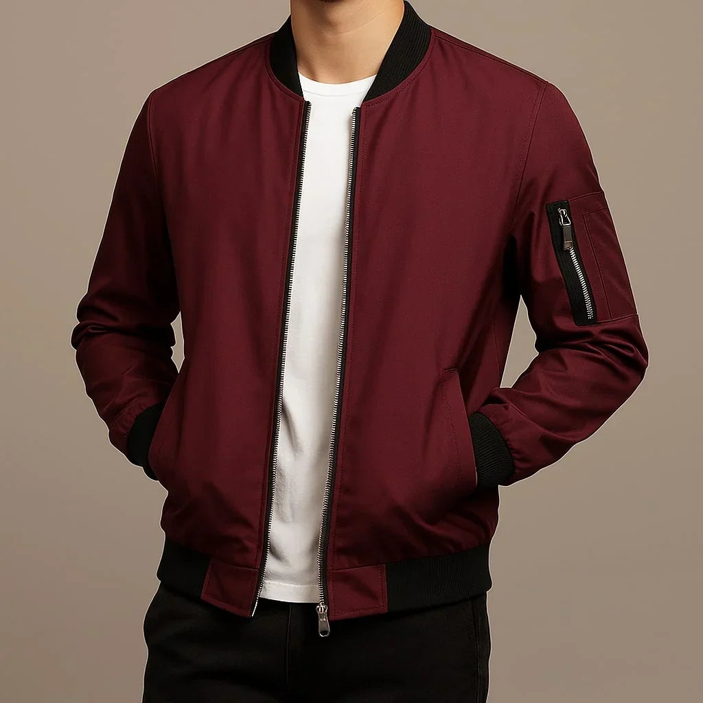 Blouson bomber bordeaux zippé, col et poignets côtelés, poche zippée sur la manche