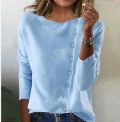 Gilet en tricot bleu clair à boutons pression, encolure carrée et manches longues.