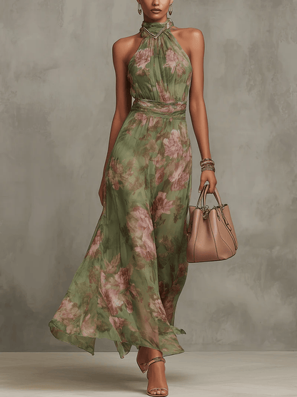 Robe longue fleurie sans manches, encolure haute, vert sauge et fleurs roses, ourlet fluide.