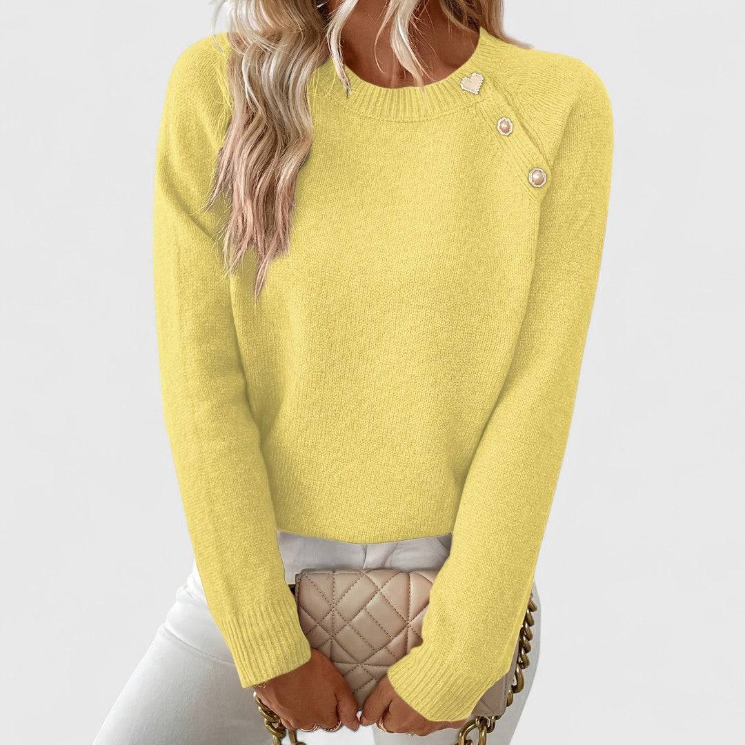 Pull col rond tricot jaune, manches longues, boutons décoratifs sur l’épaule