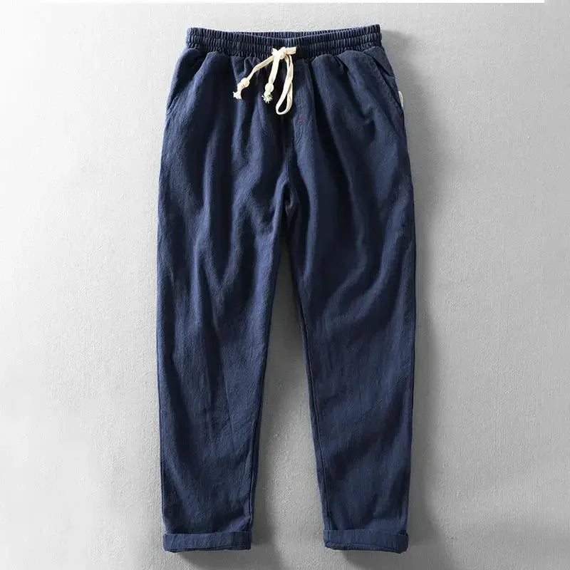 Pantalon décontracté bleu marine, taille élastique, cordon de serrage avec embouts.