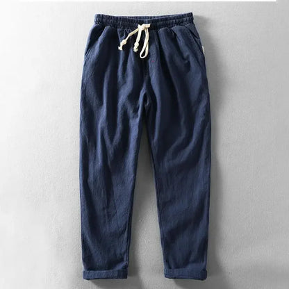 Pantalon décontracté bleu marine, taille élastique, cordon de serrage avec embouts.