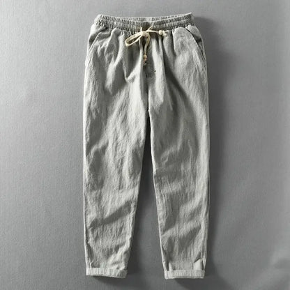 Pantalon décontracté gris clair, taille élastique, cordon de serrage à nœud.