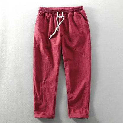 Pantalon décontracté rouge, taille élastique, cordon de serrage à glands.