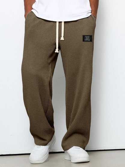 Pantalon ample marron kaki à cordon, taille élastique, poches latérales et étiquette