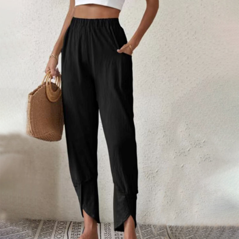Pantalon fluide noir à taille élastique, ourlet effiloché et fendu