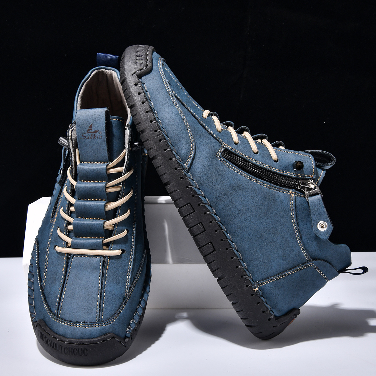 Botte en nubuck bleu zippée sur le côté, lacets et semelle crantée