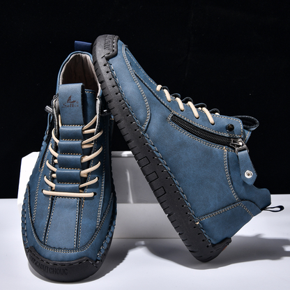 Botte en nubuck bleu zippée sur le côté, lacets et semelle crantée
