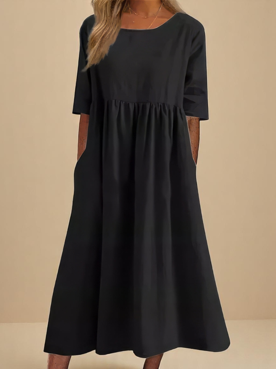 Robe en coton aéré noire, manches 3/4, encolure ronde, taille froncée, évasée
