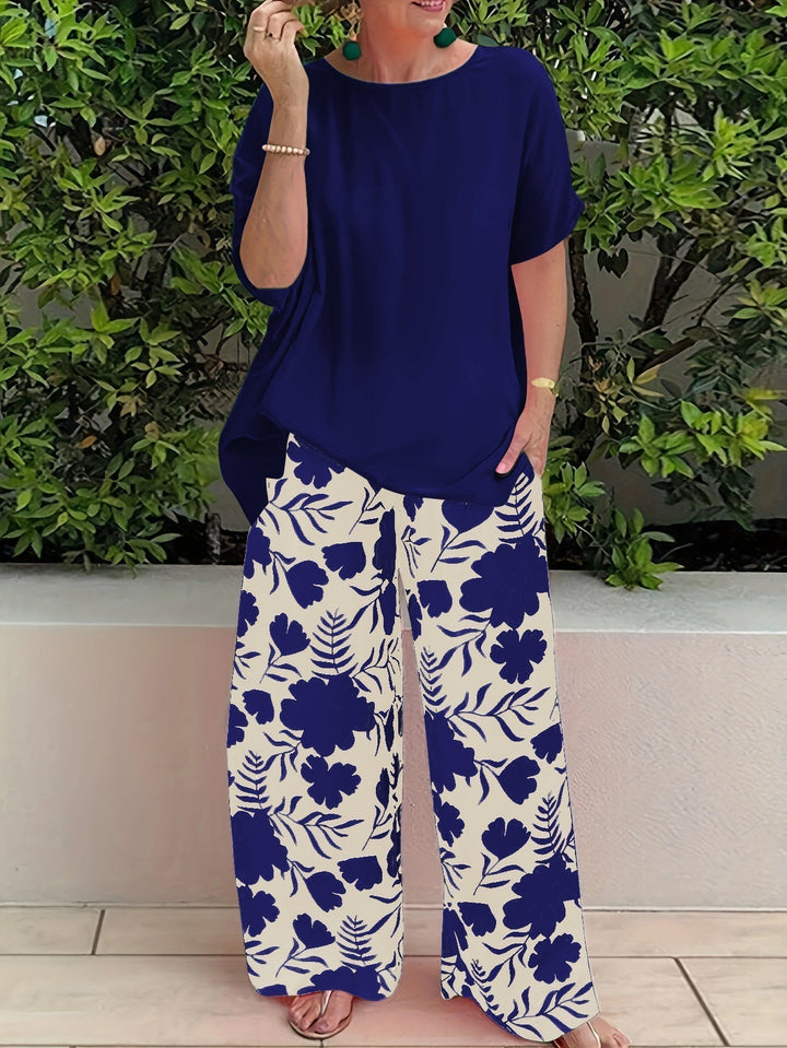 Ensemble élégant polyvalent : haut bleu à manches courtes, pantalon large fleuri bleu et blanc