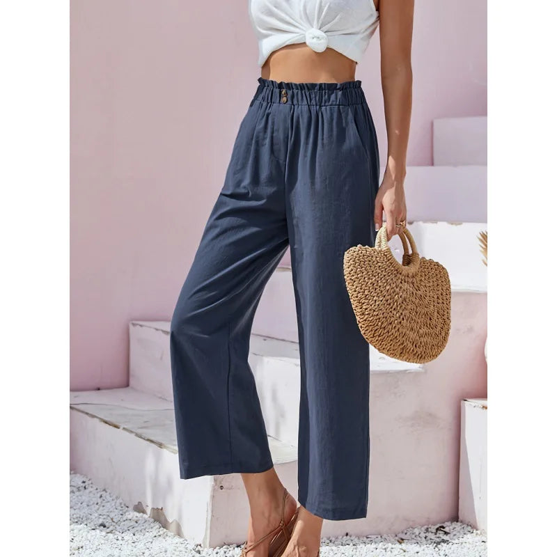 Pantalon lin-coton bleu marine, taille élastique, jambes amples 7/8.