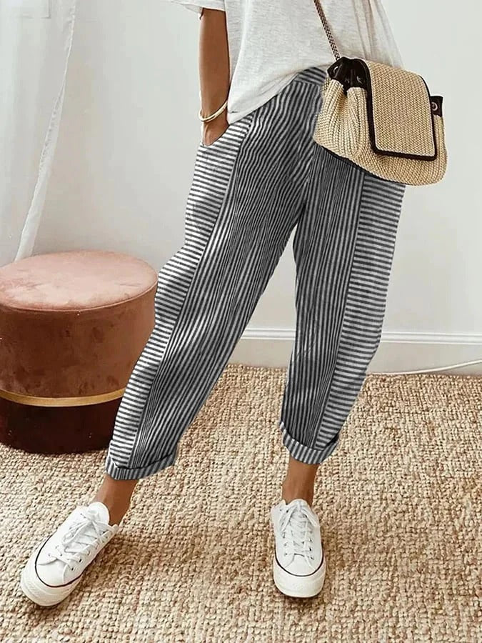 Pantalon rayé Jade à rayures verticales bleu foncé et blanc, coupe ample, longueur cheville.