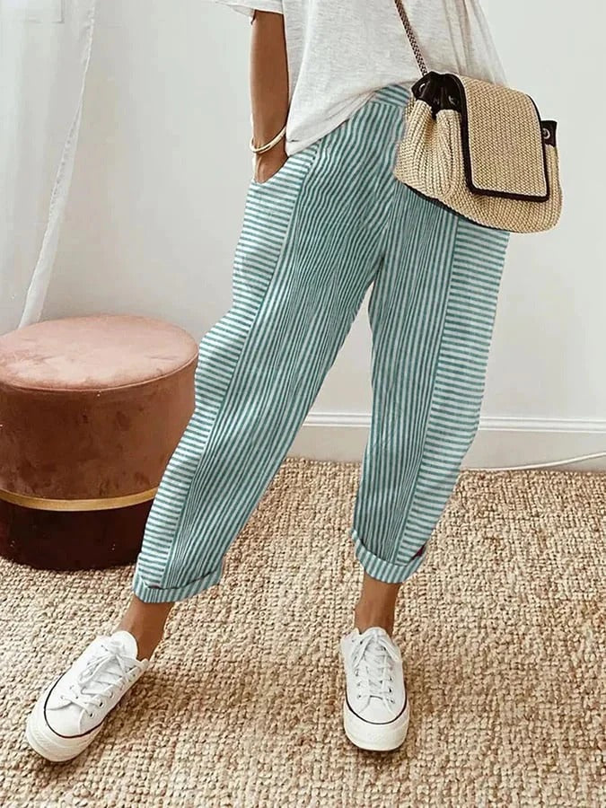 Pantalon rayé Jade à rayures verticales vert et blanc, coupe ample, longueur cheville.