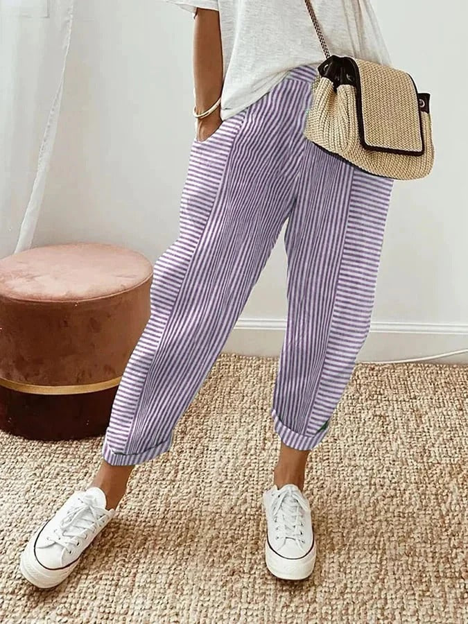 Pantalon rayé Jade à rayures verticales violet et blanc, coupe ample, longueur cheville.