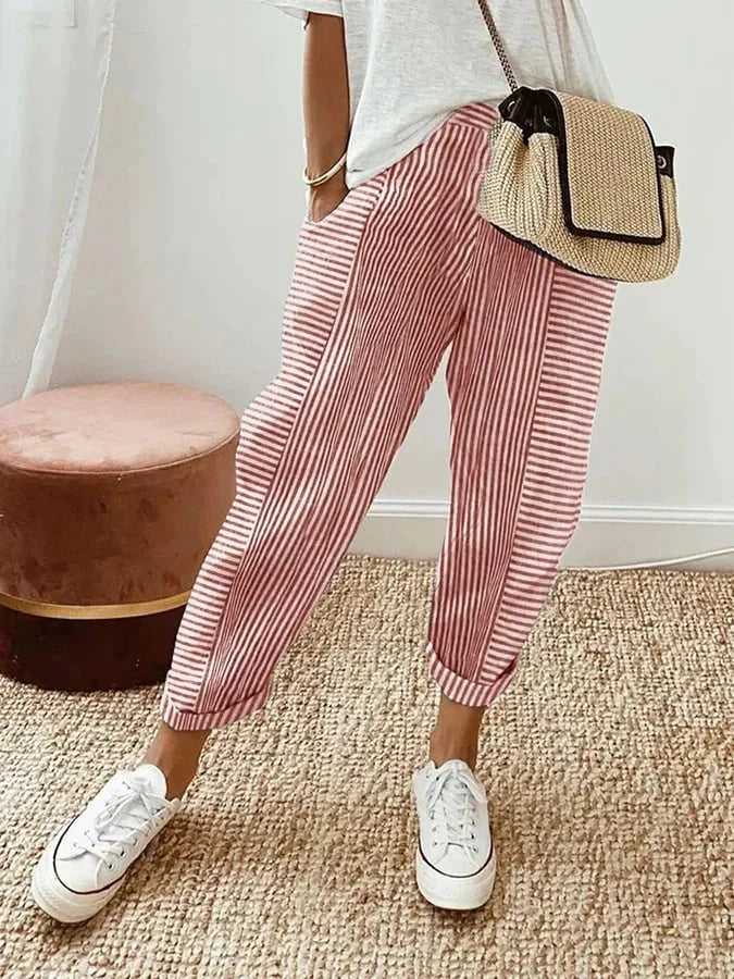 Pantalon rayé Jade à rayures verticales rose et blanc, coupe ample, longueur cheville.