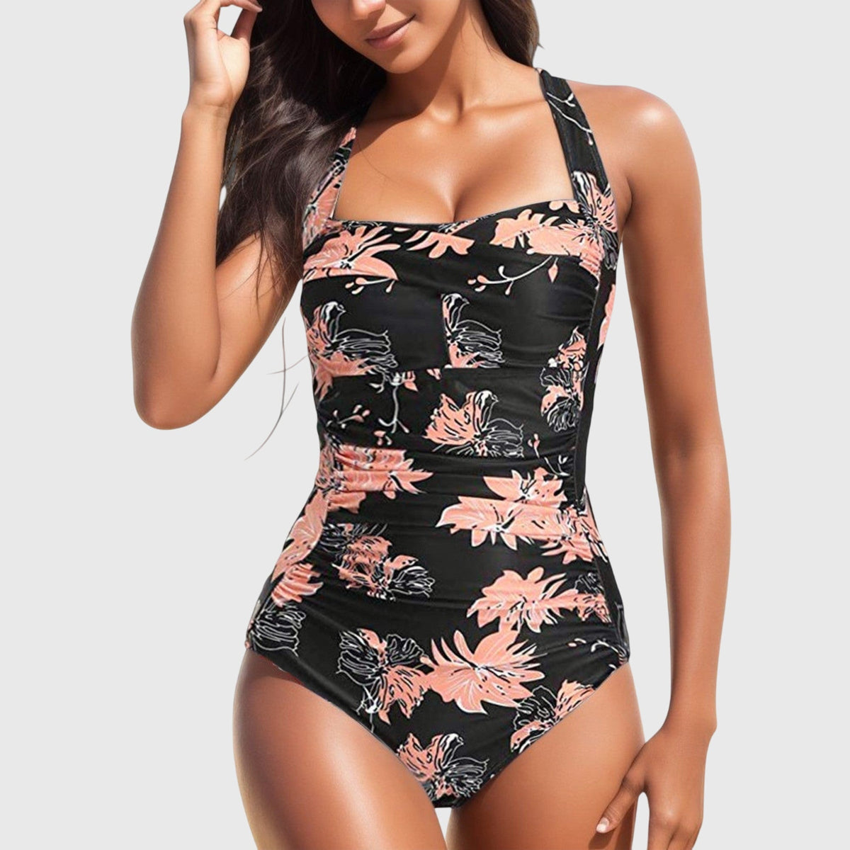 Maillot de bain une pièce noir à motifs floraux roses et feuillages, bretelles