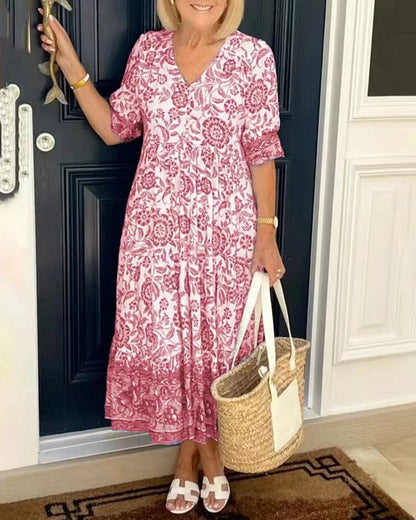 Robe fluide légère rose à imprimé floral, encolure V, manches courtes, jupe volantée