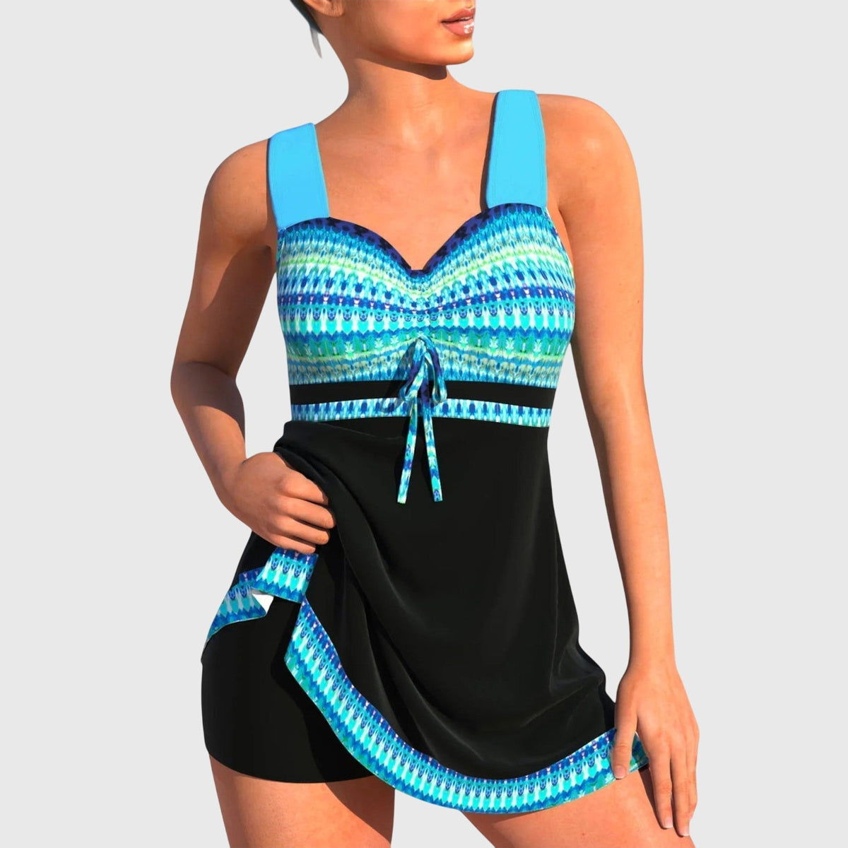 Maillot de bain deux pièces bleu à bretelles, haut à motifs, bas noir avec lien