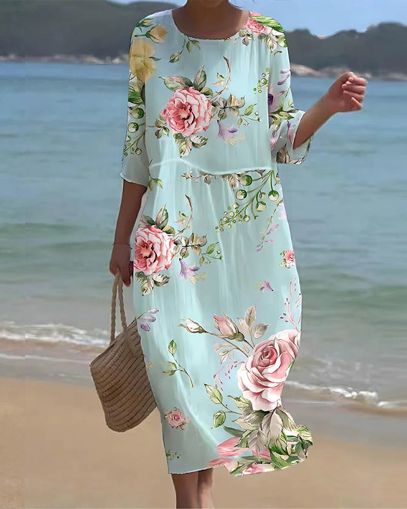 Robe mi-longue bleu clair fleurie roses, manches 3/4, ourlet droit
