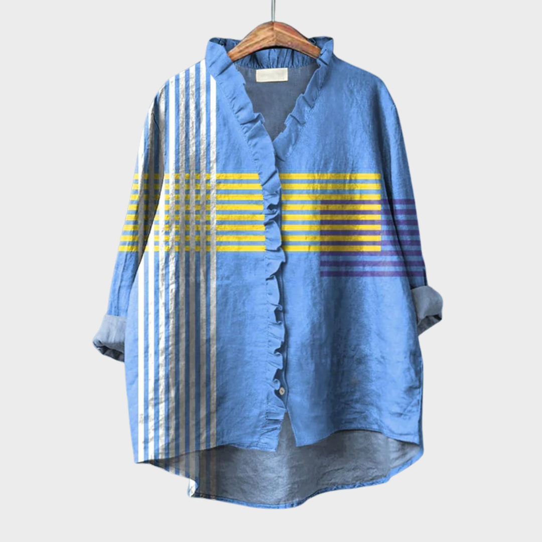 Blouse graphique Ophélie bleue à volants, rayures jaunes, encolure V boutonnée.