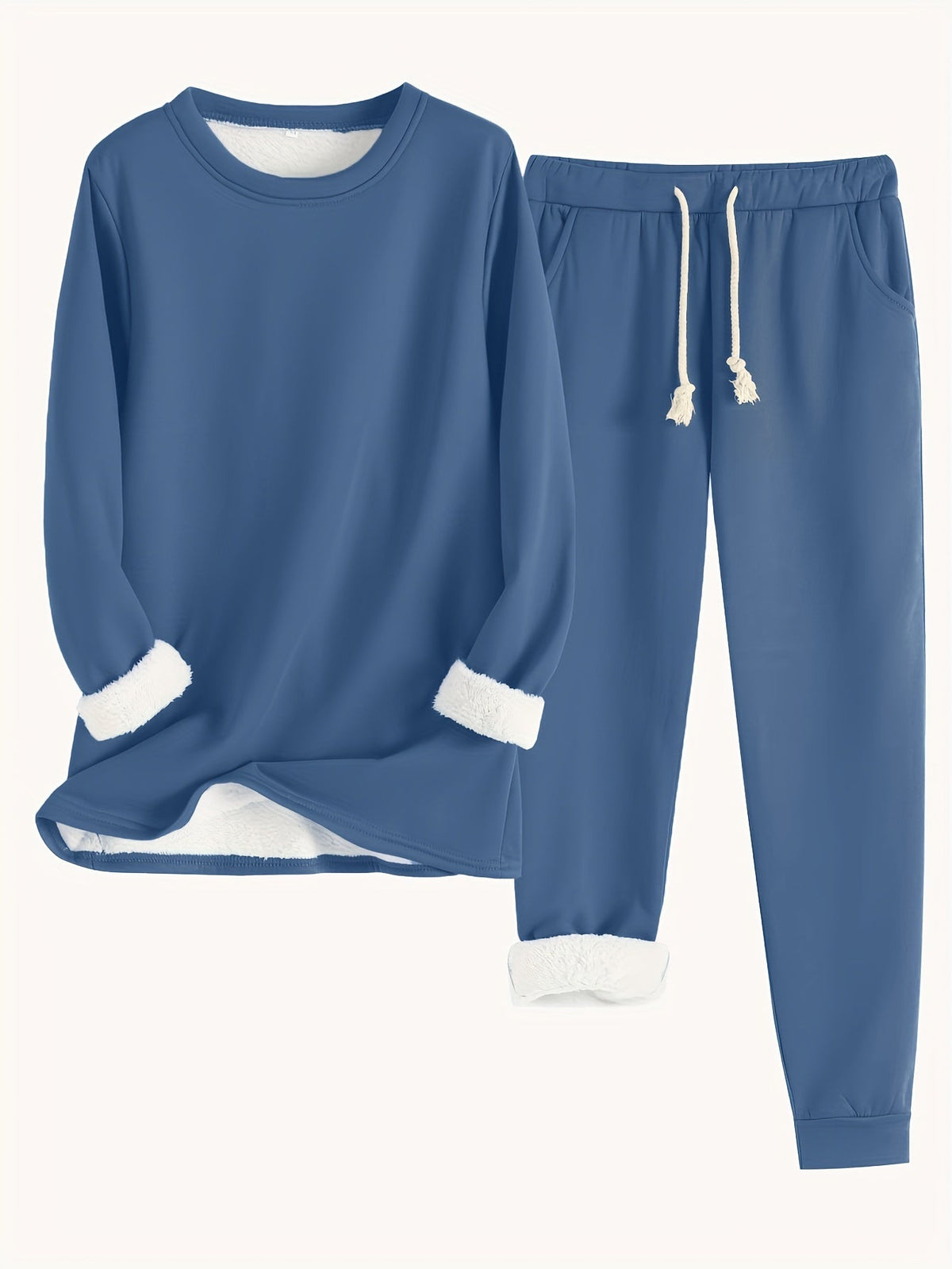 Ensemble de détente bleu : haut manches longues et pantalon ample à cordon de serrage.