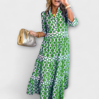 Robe midi verte à motif chaînes, manches 3/4 et empiècement à la taille