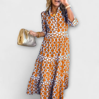Robe midi orange à motif chaînes, manches 3/4 et volants en bas