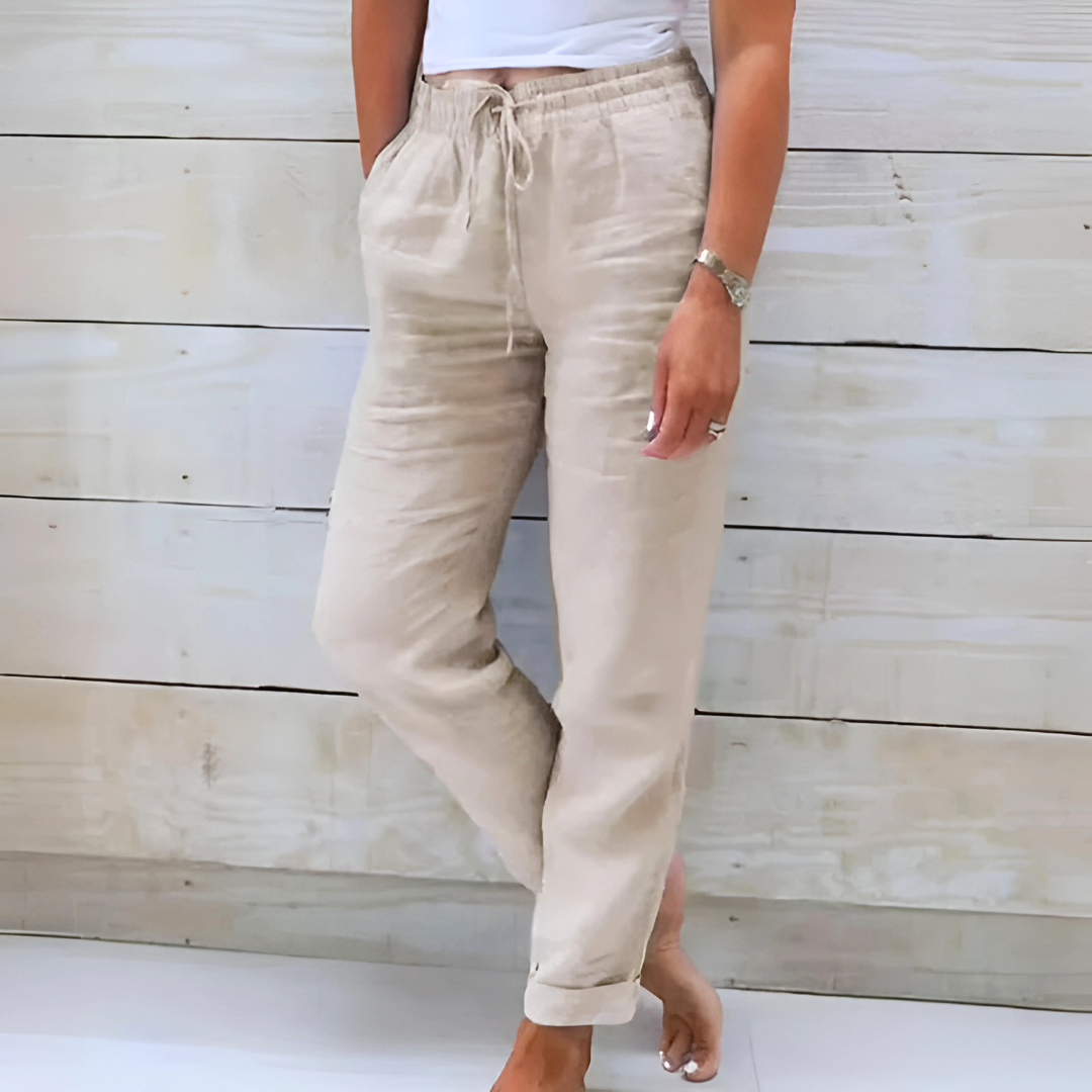 Pantalon en tissu léger beige, taille élastique à cordon, poches à l’avant