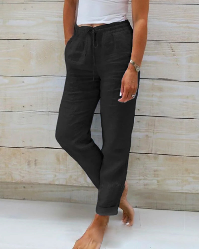 Pantalon en tissu léger noir, taille élastique à cordon, poches à l’avant