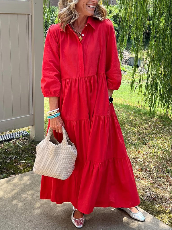Robe longue rouge à col boutonné, manches bouffantes, effet superposé à volants.