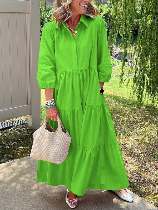 Robe longue verte à boutons, encolure ronde, manches bouffantes et jupe à volants