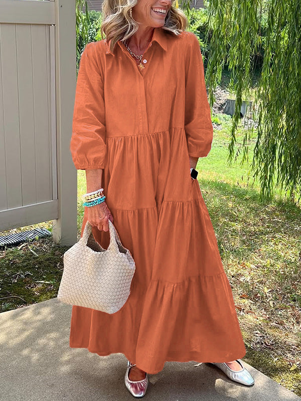 Robe longue orange à boutons, encolure ronde, manches bouffantes et jupe à volants