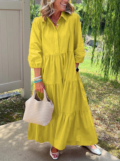 Robe longue jaune à boutons, encolure ronde, manches bouffantes et jupe à volants
