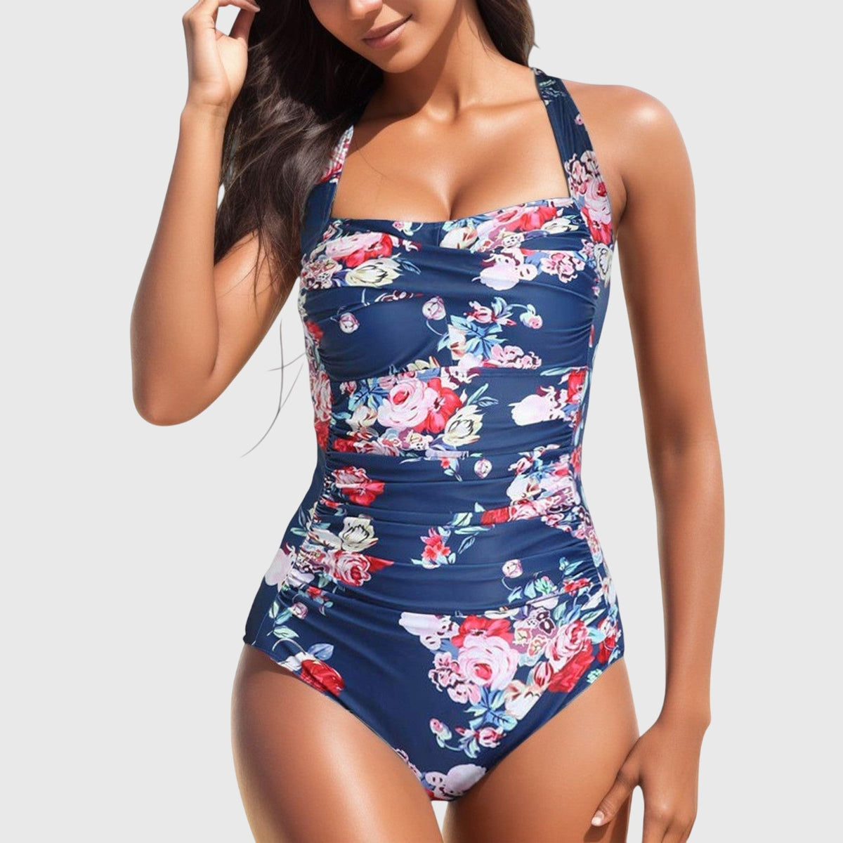Maillot une-pièce bleu marine à fleurs, bretelles fines et décolleté carré